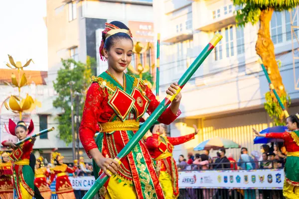 stock image Bulouh dance from Bangka Belitung on the 3rd BEN Carnival. Bulouh Dance depicts the beauty and strength of bamboo which is part of people's lives.