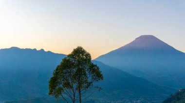 Sun set on Taman Langit Dieng, one of the famous tourist destinations in Wonosobo. clipart