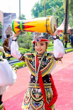 Indonesian dancer perform reog kendang dance. Reog kendang is one of dance from Tulungagung clipart