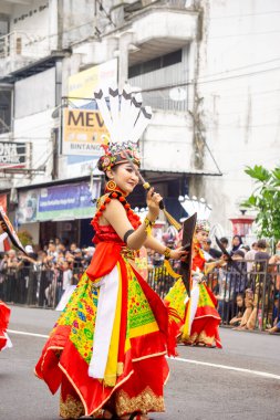 Kinyah mandau dance from Central Borneo. This dance depicts the heroic spirit and the willingness of Dayak warriors to defend the honor of their ancestral land.