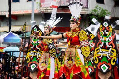 Kinyah mandau dance from Central Borneo. This dance depicts the heroic spirit and the willingness of Dayak warriors to defend the honor of their ancestral land.
