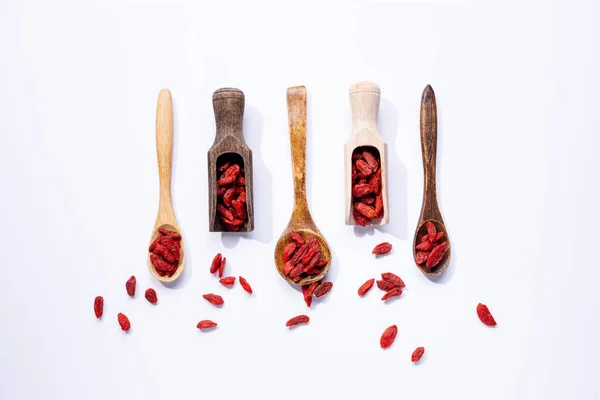 Dried Goji Berries Wooden Spoons Isolated White Background Royalty Free Stock Images