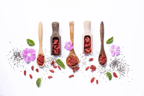Flat Lay Composition Dried Goji Berries Wooden Spoons White Background Stock Picture