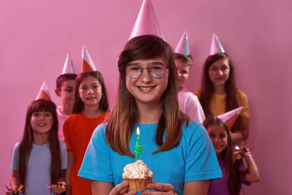 Smiling Caucasian Girl Wearing Glasses Holding Birthday Cupcake Candle Background Imagen de stock