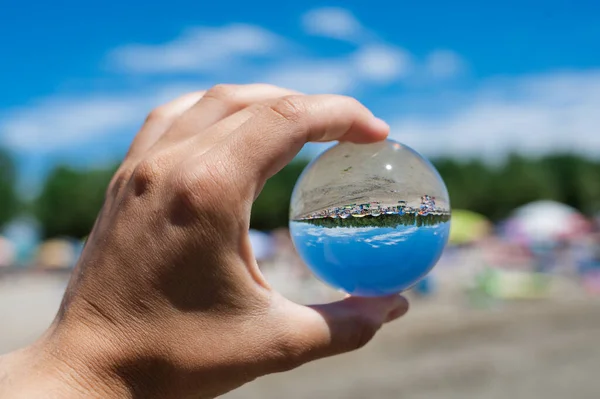 Crystal ball display a clear water and dirty water,enviroment saving, abstract meaning environment in hand