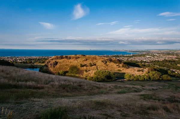 Cityscape of Edinburgh from Arthurs Seat in a beautiful summer sunny day, Scotland, United Kingdom