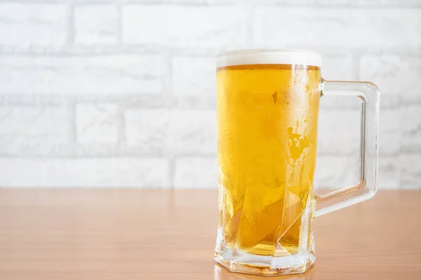 stock image Draft beer in beer glasses placed on a wooden table.