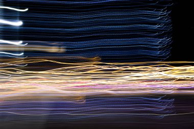 Soyut arkaplan ve dokudan oluşan hareket ışıklarının bulanık rengi.