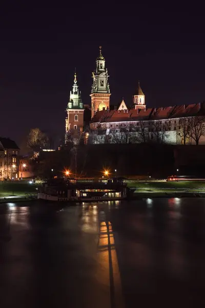 stock image Krakow, Poland - February 12, 2020: Beautiful Wawel Royal Castle in Krakow in the night scenery.