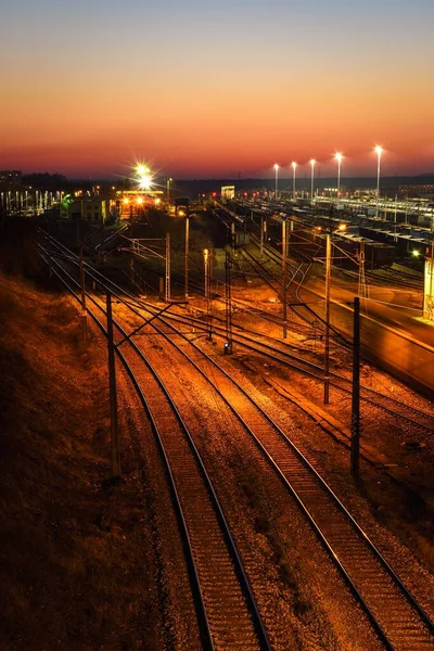 stock image Railway station in the evening scenery. Railroad tracks at Kielce Herby station, Poland.