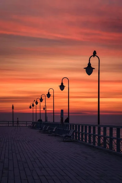 stock image Beautiful sunrise over the Polish sea. Popular pier on the Baltic Sea at sunrise. Photo taken in Gdynia, Poland.