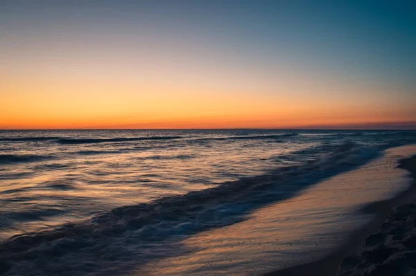 stock image Beautiful colorful landscape on the beach by the sea. Sunrise over the Baltic Sea in Jastarnia, Poland.