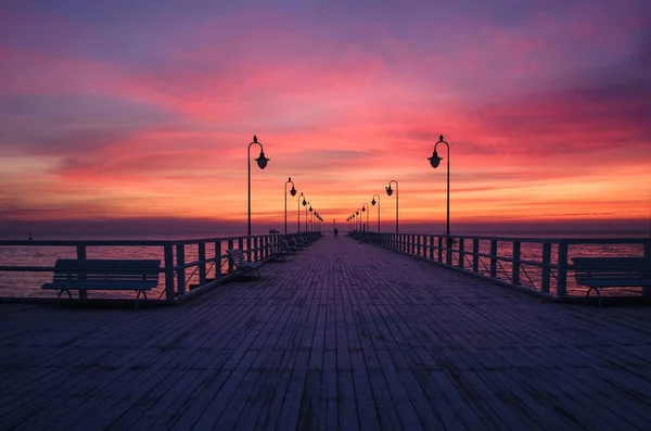 stock image Beautiful sunrise over the Polish sea. Popular pier on the Baltic Sea at sunrise. Photo taken in Gdynia, Poland.