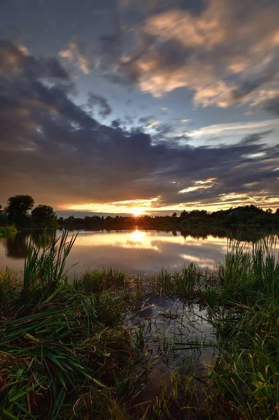 stock image Beautiful colorful landscape by the lake in the countryside. Sunset on the Mojcza lake near Kielce, Poland.