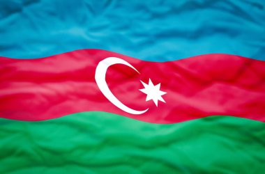 Dalgalı bir arka planda Azerbaycan bayrağı. Azerbaycan 'ın dalgalı bayrağı çerçeveyi dolduruyor.