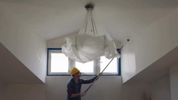 Adult Man Paints Wall Roller Makes Repairs Room Attic Floor — Video
