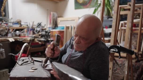 Senior Elderly Master Jeweler Wheelchair Works Workshop Anvil — Vídeo de stock