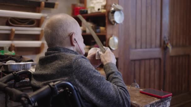 Senior Gray Haired Male Master Wheelchair Working His Workshop Sharpening — Vídeos de Stock