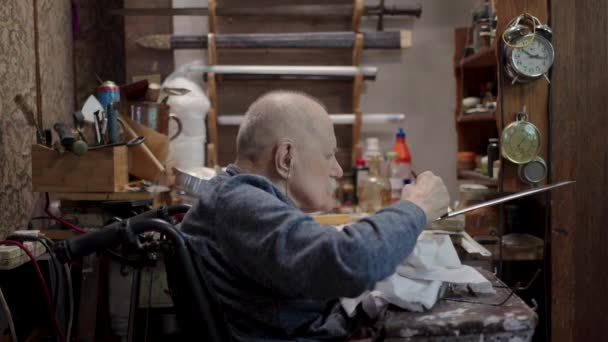 Senior Gray Haired Male Master Wheelchair Working His Workshop Sharpening — Wideo stockowe