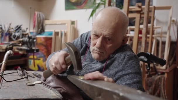 Senior Elderly Master Jeweler Wheelchair Works Workshop Anvil — Stockvideo