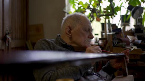 Elderly Male Master Works His Workshop Restoring Japanese Sword Sheath — Stock video
