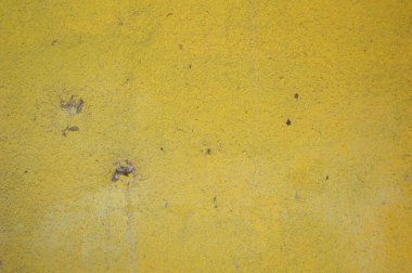 Sarı duvarlar kirli ve eski. duvar kağıdı olarak kullan