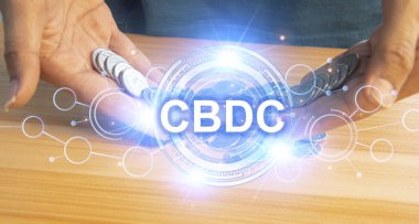 CBDC bir merkez bankası tarafından verilen dijital para birimidir. mal ve hizmetleri ödemek için bir araç olarak hareket edebilen, değeri koruyabilen ve bir ölçü birimidir.