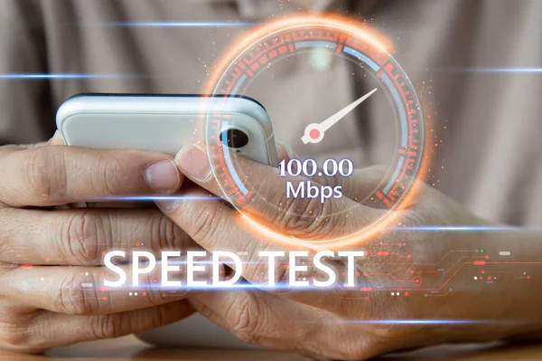 stock image fast internet connection speedtest network bandwidth technology Man using high speed internet with smartphone and laptop computer. 5G quality, speed optimization.