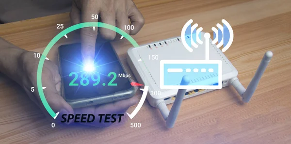 stock image fast internet connection speedtest network bandwidth technology Man using high speed internet with smartphone and laptop computer. 5G quality, speed optimization.