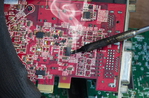 Motherboard repair parts soldering male close-up