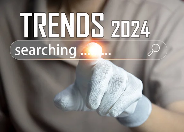Trends for 2024, New Year symbols Businessman uses search New trends that people will be interested in in 2024