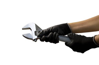 Tamirci büyük ayarlanabilir bir İngiliz anahtarı tutuyor. 375 mm, beyaz arka plan.