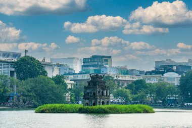 Hoan Kiem Lake ( Ho Guom) or Sword lake in the center of Hanoi in cinematic sunset sky. Hoan Kiem Lake is a famous tourist place in Hanoi. clipart