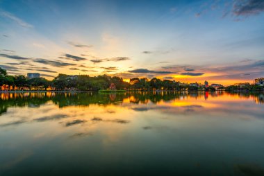 Hoan Kiem Lake ( Ho Guom) or Sword lake in the center of Hanoi in cinematic sunset sky. Hoan Kiem Lake is a famous tourist place in Hanoi. clipart