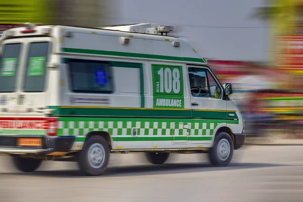 Ambulance running in emergency on the road to save a live from getting exhausted, Orissa or Odisha,India.