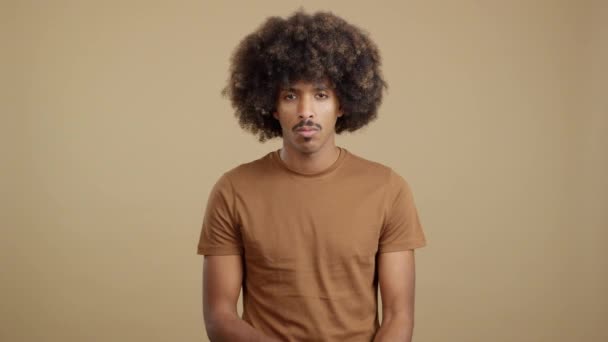African Man Curly Hair Crossing Arms While Looking Camera Angry — Stockvideo