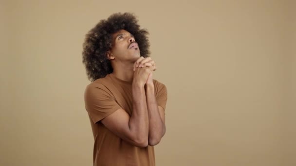 African Man Curly Hair Looking While Praying Folded Hands Studio — Stockvideo