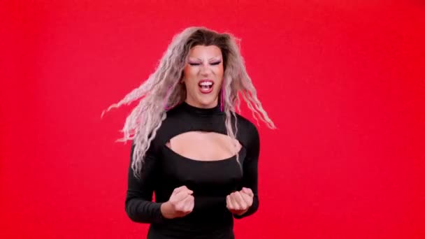 Passionate Transgender Person Make Celebrating Raising Fist Studio Red Background — Stockvideo