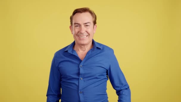 Happy Mature Man Gesturing Agreement Raising Thumb Studio Yellow Background — Stok video