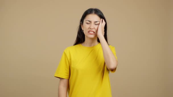 Caucasian Woman Gesturing Bodily Discomfort Headache Studio Brown Background — Stock video