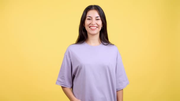 Woman Blowing Kiss While Looking Camera Studio Yellow Background — Vídeo de Stock