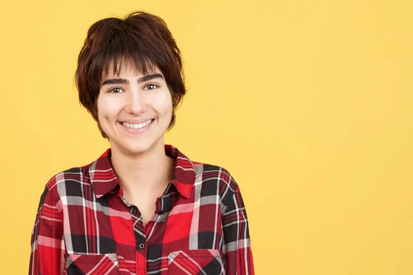 Androgynous Person Smiling While Looking Camera Studio Yellow Background — Stock Photo, Image