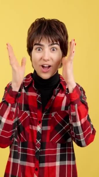 Cool Androgynous Person Looking Camera While Expressing Surprise Studio Yellow — Stockvideo
