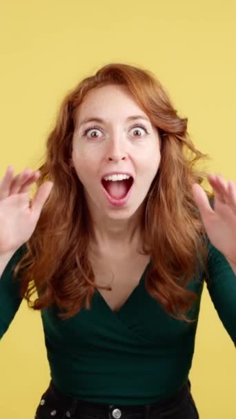 Surprised Redheaded Woman Gesturing Looking Camera Studio Yellow Background — Stock Video