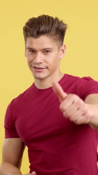 Strong Man Brackets Gesturing Approval Thumb Studio Yellow Background — Stock Video