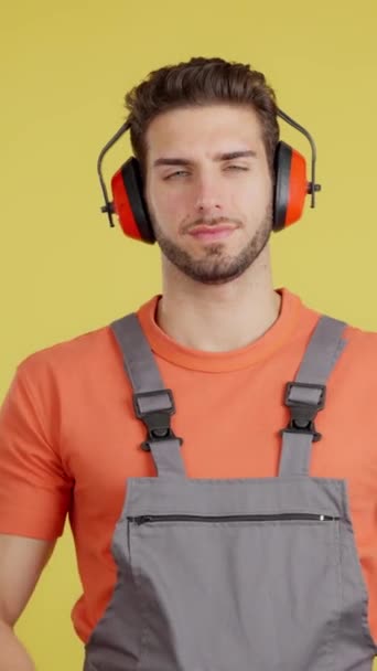 Serious Caucasian Worker Headphones Standing Arms Crossed Looking Camera Studio — Stock Video