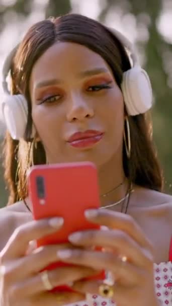 Transgender Woman Listening Music Mobile Park — Stockvideo