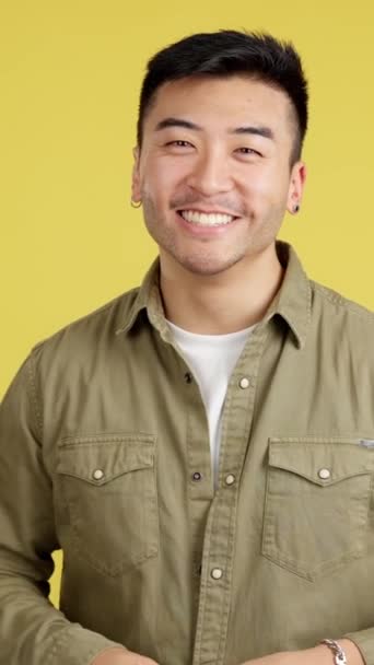 Chinese Man Laughing Looking Camera Studio Yellow Background — Stock Video