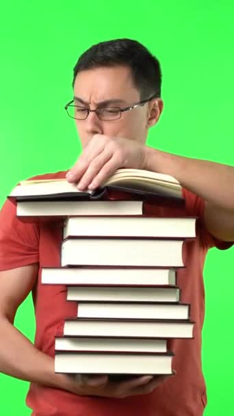Clever Male Student Holding Many Books Reading Interest Exam Preparation — Stock Video