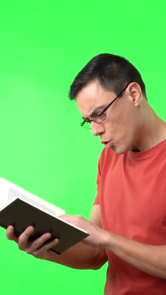 Astonished Intelligent Male Eyeglasses Reading Book Expressing Amazement Opened Mouth — стоковое видео